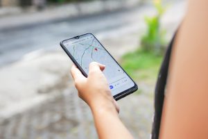 Close up of women using Google Maps on cellphone